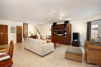 Another view across the living room with the half-bathroom.