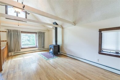 Living Room with Wood Burning Stove that could hea