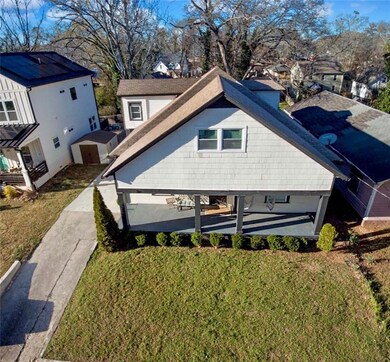Rear view of property with a residential view, a s