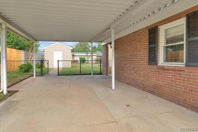 View of terrace featuring a storage shed