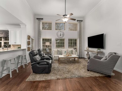 The living room is filled with natural light and b