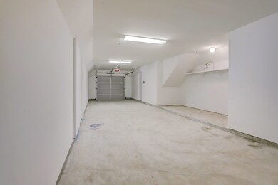 2 car stacked garage with storage area.