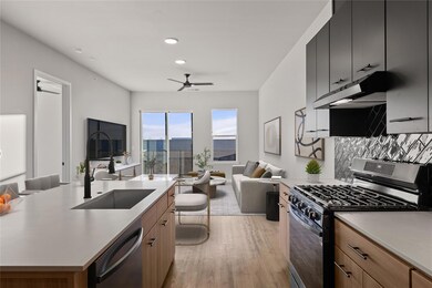 Kitchen with stainless steel appliances, open flo