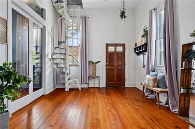 What an entrance with the spiral steps leading to additional 295 soft of bonus space
