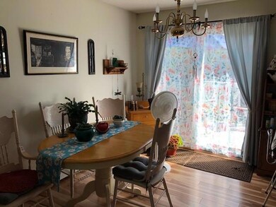 Dining room with laminate floors and...