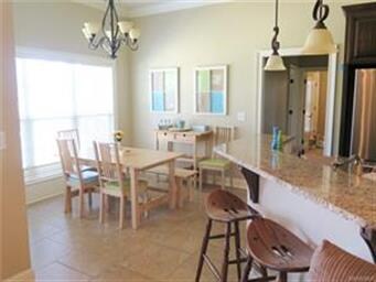 Kitchen bar opens to great room and breakfast room