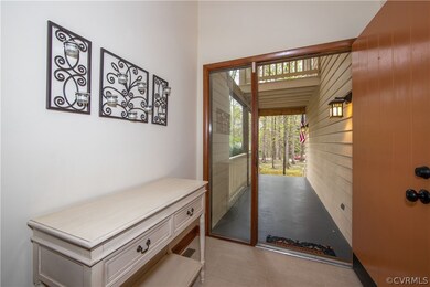 Wide front porch entry with door side light and li