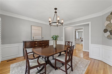 The bright formal dining room features classic tri