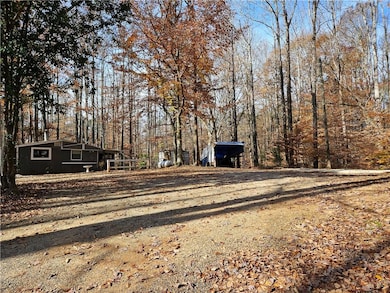 View of street featuring dirt driveway