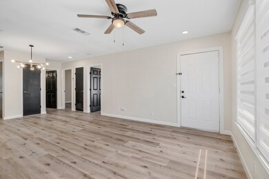 Unfurnished living room featuring recessed lighting, a chandelier, light wood finished floors, and ceiling fan