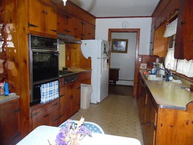 Kitchen with built in wall oven and counter top ra
