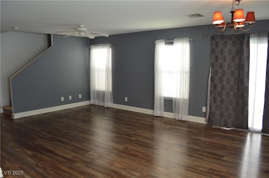 Spare room featuring a chandelier, plenty of natur