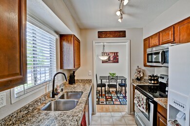 KITCHEN WITH GRANITE COUNTER TOPS