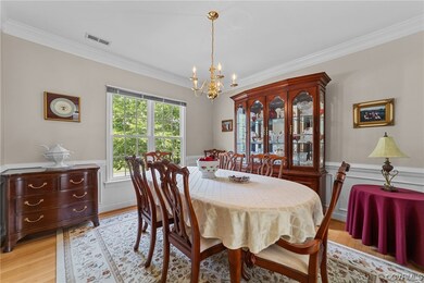 Formal dining room with crown molding, chair rail and picture molding