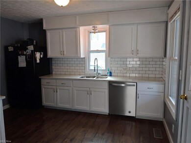 Renovated kitchen with solid surface countertops, 