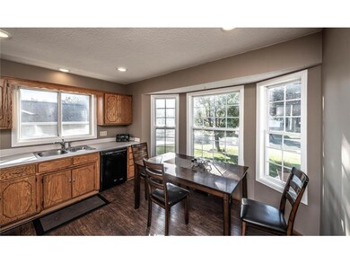 Additional view of the kitchen showing a breakfast