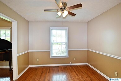 The formal dining room also has hardwood floors and is located off the living room and kitchen.