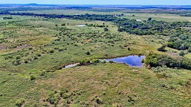 Bird's eye view of a large body of water and a heavily wooded area