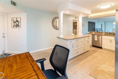 Kitchen featuring dishwasher, light wood-type floo