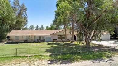 Ranch-style house featuring a front yard