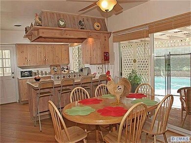 The kitchen opens to the kitchen dining area and l