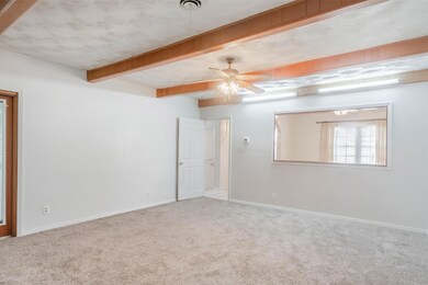 Living area with door to sunroom on left