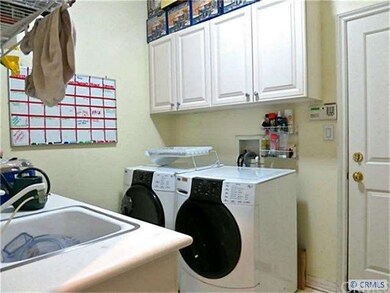 extra large laundry room with additional storage