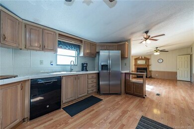 Kitchen is loaded with cabinets, hardwoods, built 