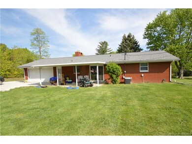 Back view of the home shows the covered back patio