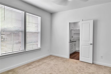 Unfurnished bedroom featuring a walk in closet, ca
