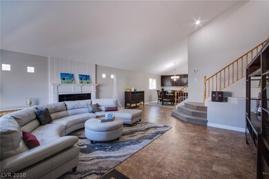 VAULTED CEILING ENTRYWAY INTO FORMAL LIVING ROOM.