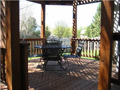 Lattice-covered deck on SE corner of house is conn