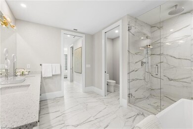 Full bathroom with vanity, toilet, and independent