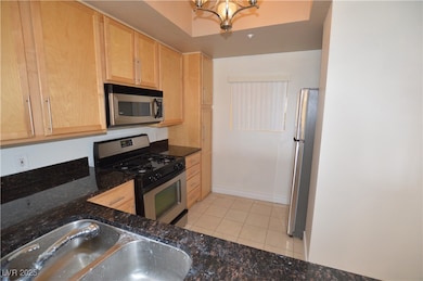 Kitchen featuring stainless steel appliances, ligh