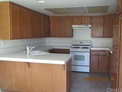 Kitchen with tile counter top and breakfast nook