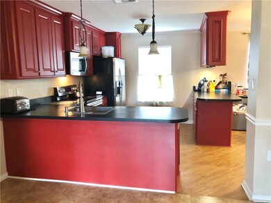 Open flowing kitchen with plenty cabinet space. Di