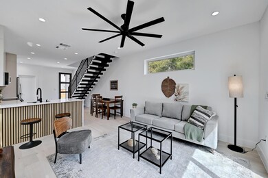 Living area with recessed lighting, stairway, ple