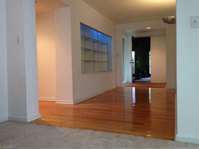 View of front hallway looking in to Breezeway. Lit