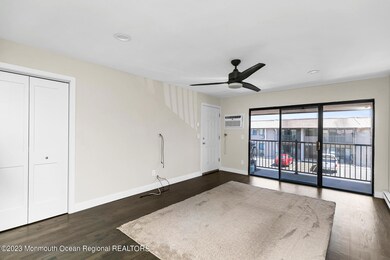 Living Room with Sliders to Balcony