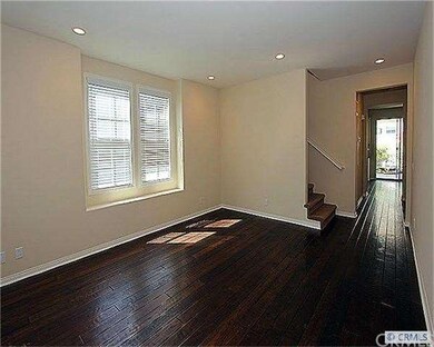 Rich Hardwood Floors. Hallway to Kitchen and Famil