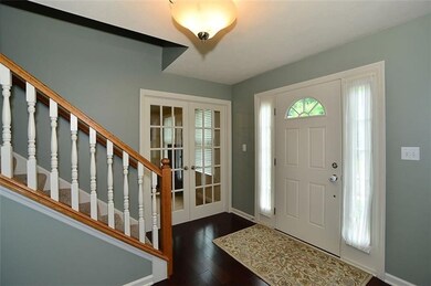 The inviting entry features newer hardwood floorin