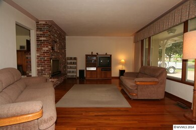 Living Room with Hardwood Floors & a Large Picture