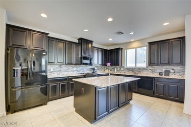 Kitchen featuring light tile patterned floors, lig
