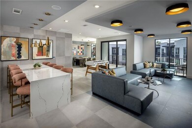 Common area featuring recessed lighting and tile walls