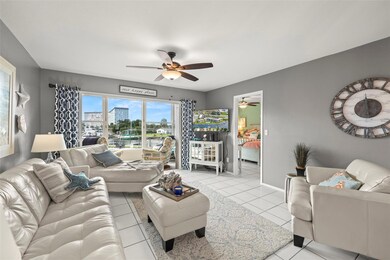 View from the dining room toward the enclosed balcony and primary bedroom.
