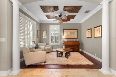 Cozy living room with plantation shutters and beau