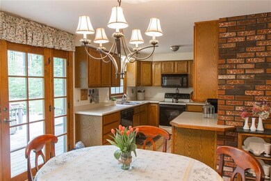 Kitchen leads out French doors to...