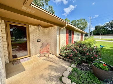 Property entrance featuring brick siding