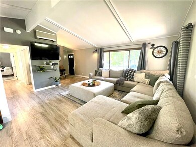 Trendy paint colors, open floor plan and vaulted c