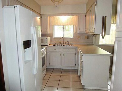 Photo. Cute kitchen with ceramic tile. Side by sid